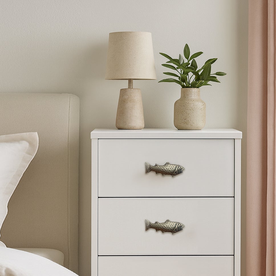 Fini antique de bouton de poisson
